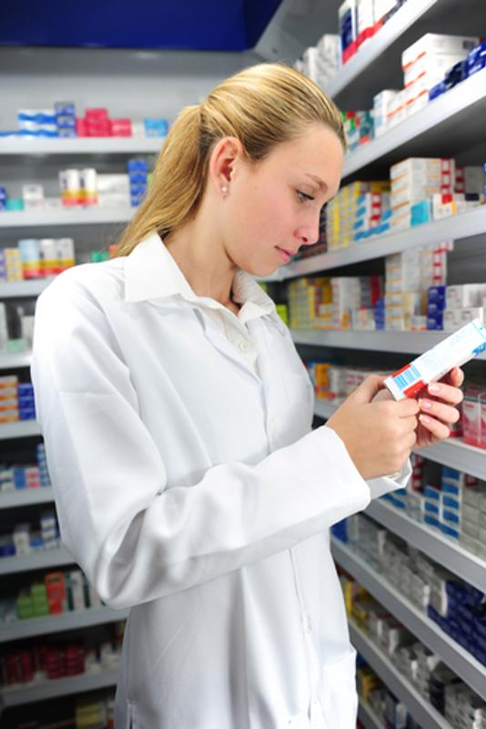 pharmacist examining medication label