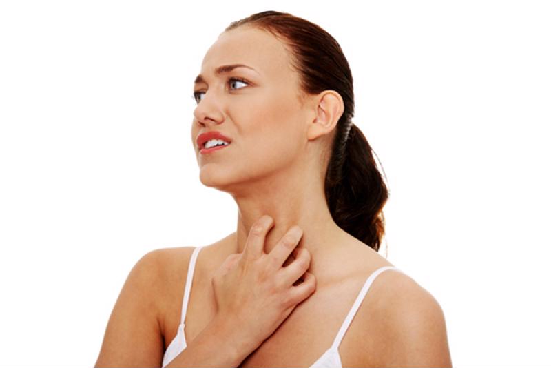 woman scratching her neck